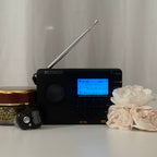 TDBR Qur'ān Radio+ portable Qur'an audio player, styled with white roses on a neutral background